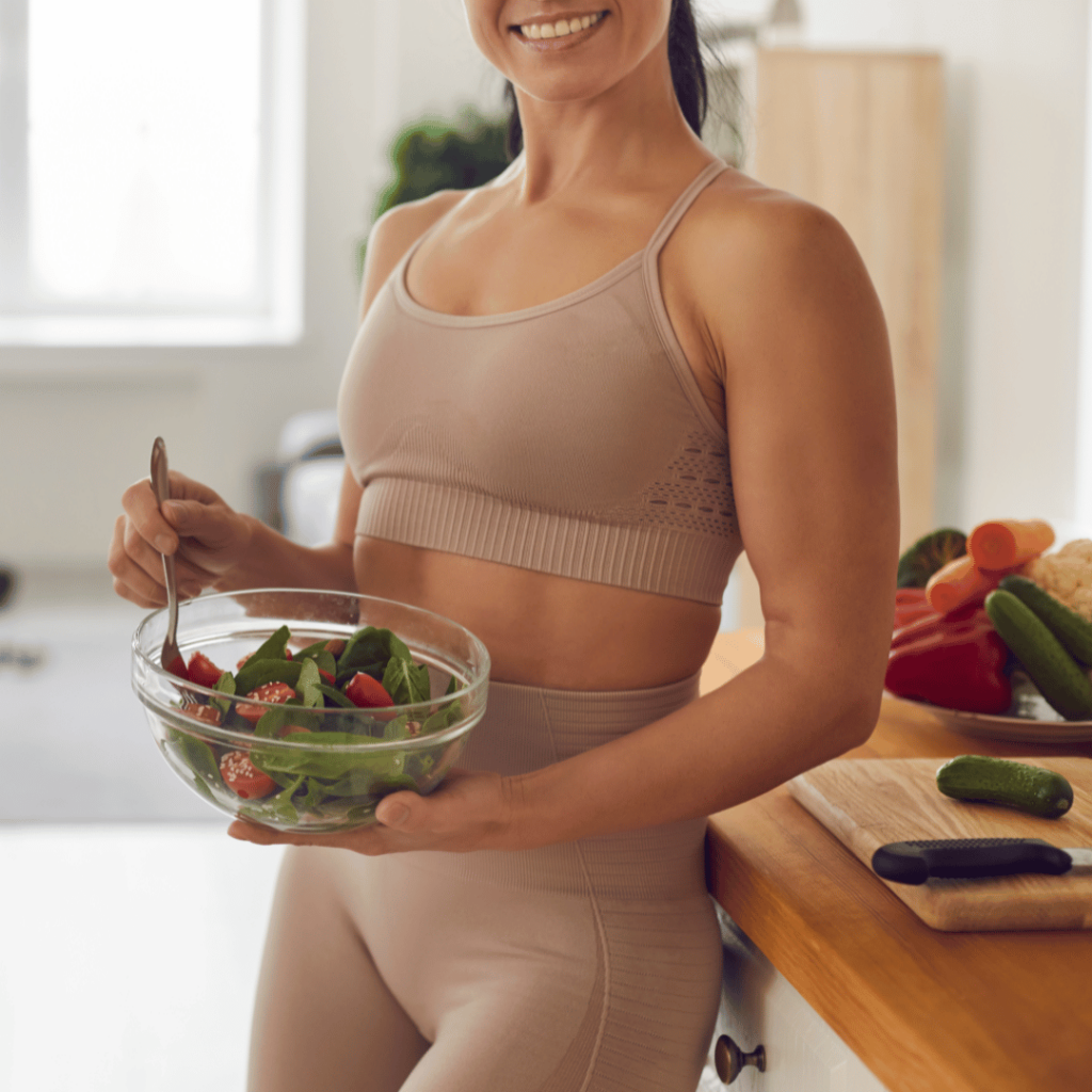 fit woman with salad