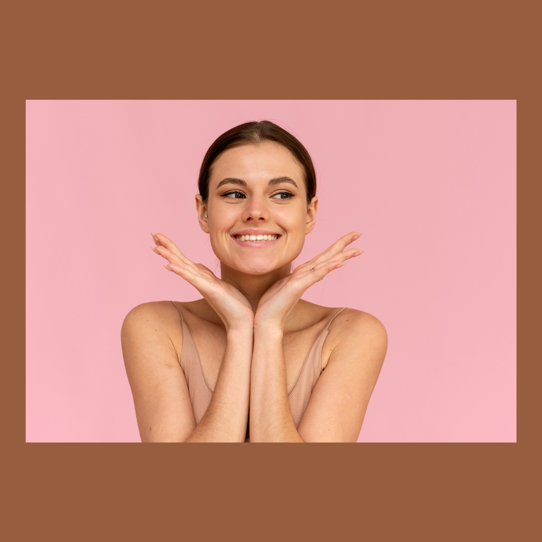 woman smiling with pink background